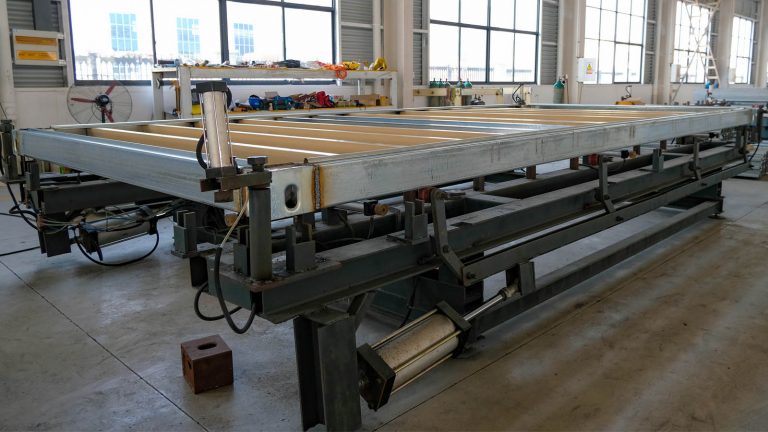 Container frame on a welding fixture in the workshop