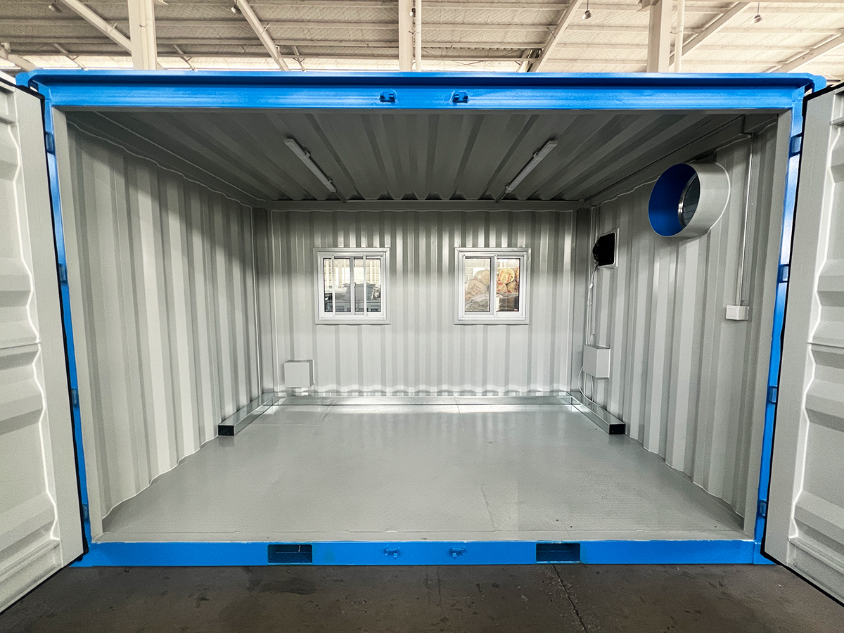 Compact enclosure interior with forklift pockets and ventilation openings